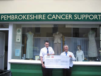 Murco representative presenting the cheque